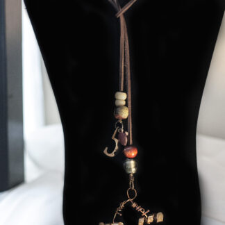 brown leather and brass lariat
