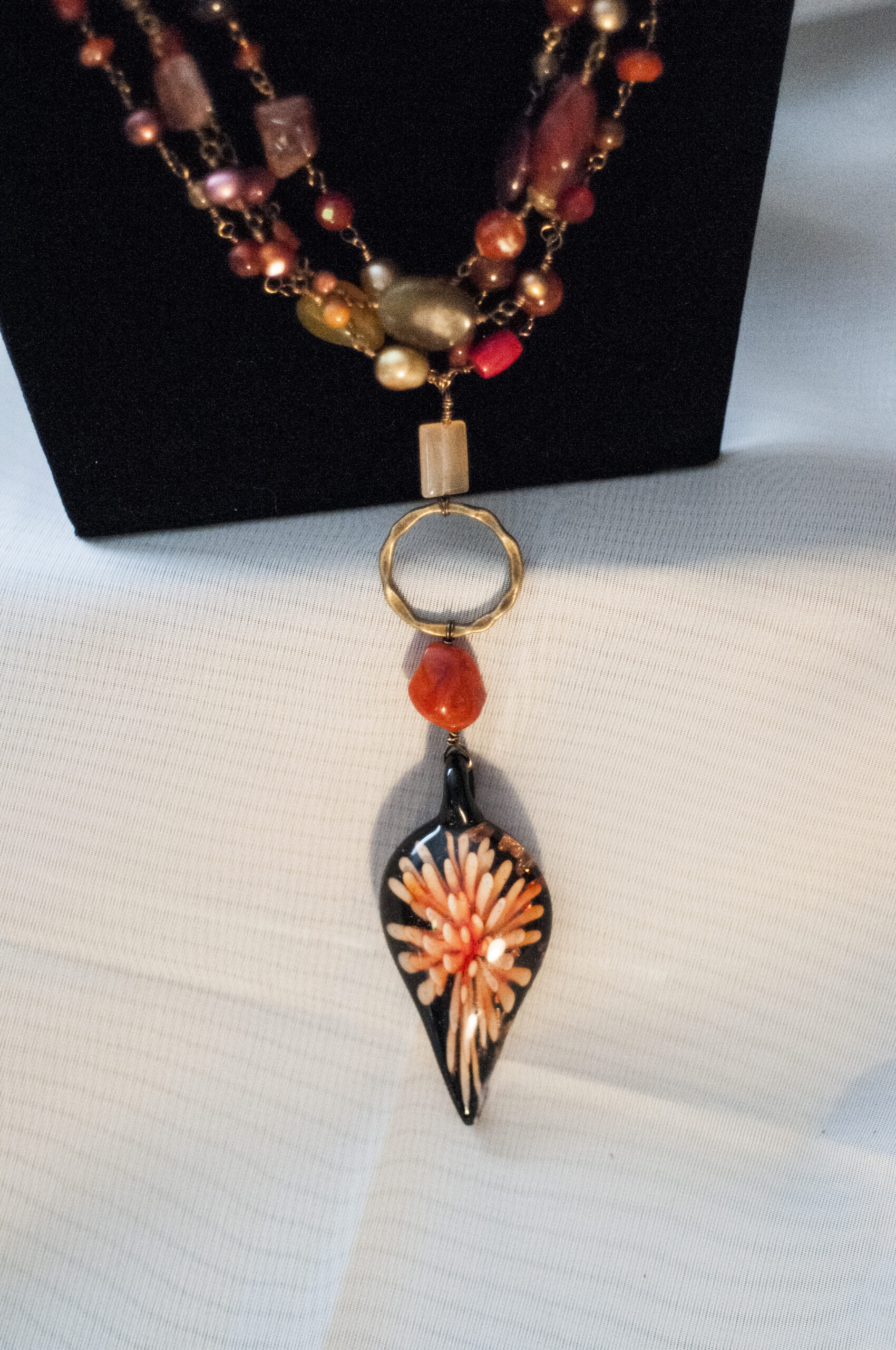 close up of flame pendant and wire wrapping